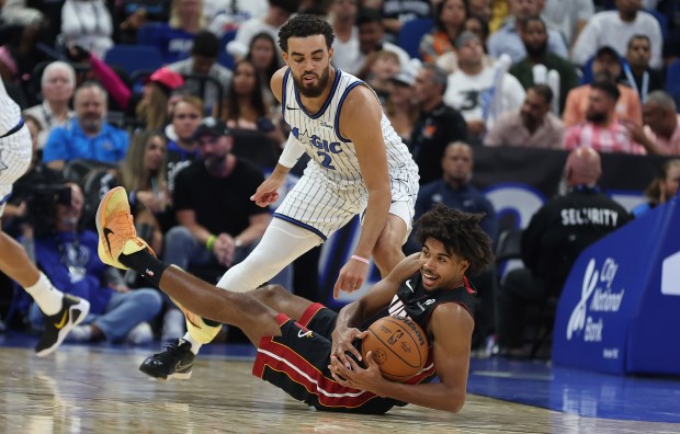 Orlando guard Tyus Jones (2) defends as Miami guard Ethan...