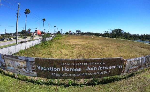 Signage at an empty lot at the Magic Village construction...