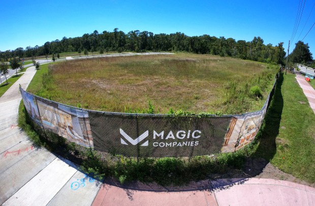 Signage at an empty lot at the Magic Village construction...