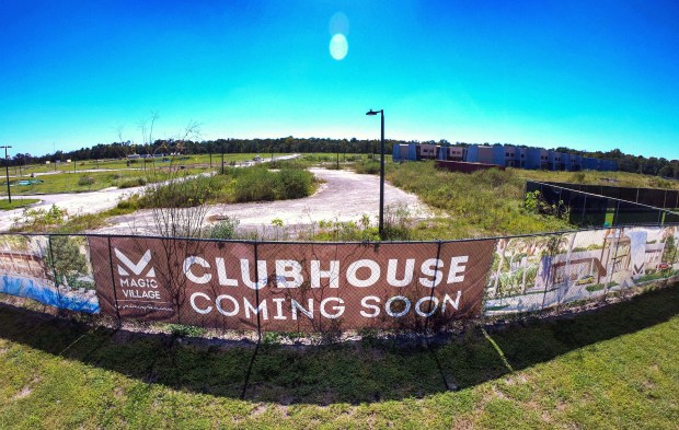 Signage at the Magic Village construction site in Kissimmee advertises...