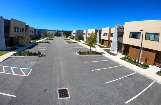 Completed townhomes on Torino Road at the Magic Village construction...