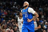 Dallas Mavericks center Daniel Gafford (21) grimaces in pain during the second half of an...