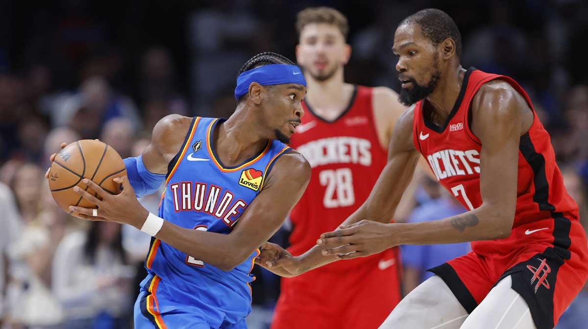 Thunder guard Shai Gilgeous-Alexander (2) keeps the ball away from Houston Rockets forward Kevin Durant (7) during the second half at Paycom Center