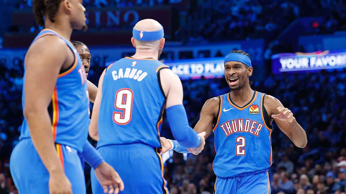 Thunder guard Shai Gilgeous-Alexander (2) celebrates with guard Alex Caruso (9) after a basket against the Dallas Mavericks during the second half at Paycom Center