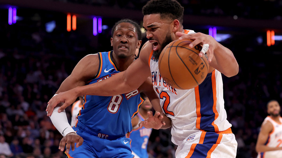 New York Knicks center Karl-Anthony Towns (32) drives to the basket against Oklahoma City Thunder forward Jalen Williams (8) during the third quarter at Madison Square Garden. 