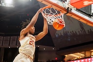 Texas guard Tre Johnson dunks the ball during the second half an NCAA college basketball...