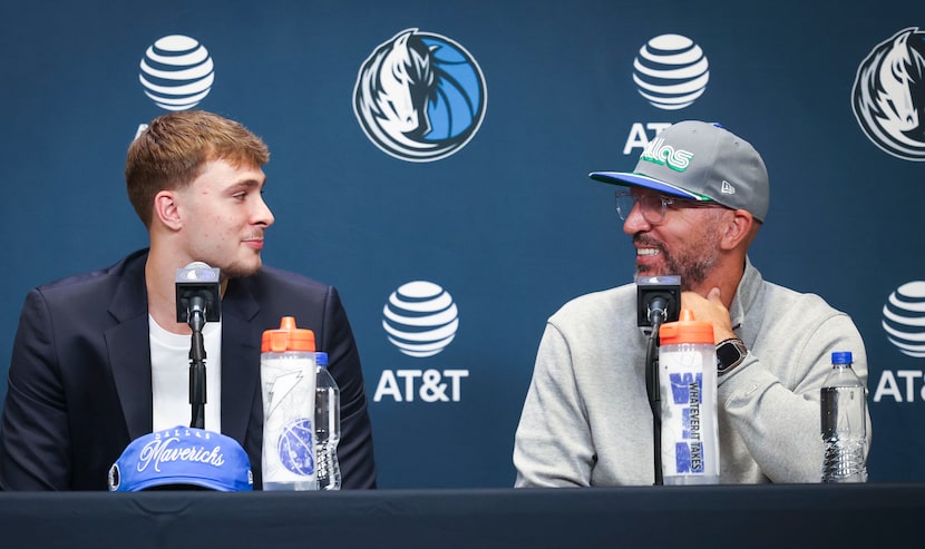 Dallas Mavericks first overall pick Cooper Flagg (left), looks towards head coach Jason...