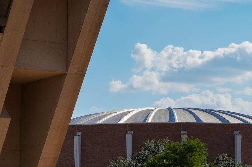 Portions of  Dallas City Hall with a portion of the arena at he Kay Bailey Hutchison...