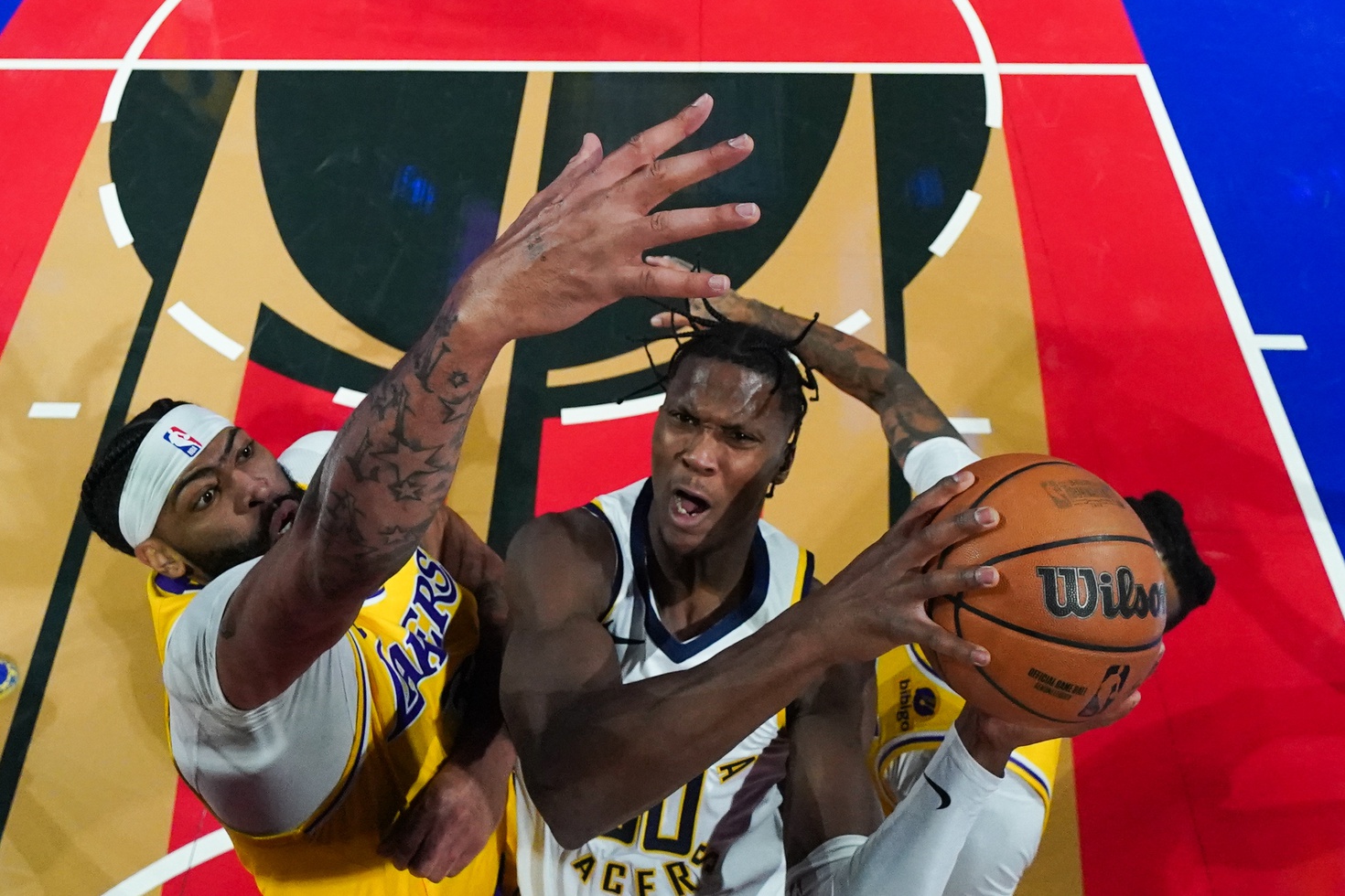 Indiana Pacers wing Bennedict Mathurin attempts to score against Los Angeles Lakers defense