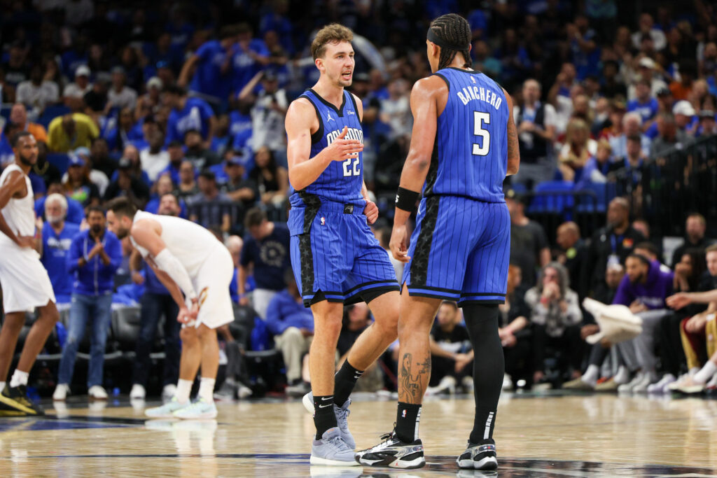 Apr 27, 2024; Orlando, Florida, USA; Orlando Magic forward Franz Wagner (22) and forward Paolo Banchero (5) celebrate after a basket against the Cleveland Cavaliers in the third quarter during game four of the first round for the 2024 NBA playoffs at Kia Center. Mandatory Credit: Nathan Ray Seebeck-Imagn Images