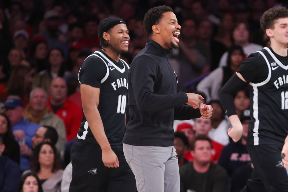 Feb 1, 2025; New York, New York, USA; Providence Friars head coach Kim English celebrates during a timeout called by the St. John's Red Storm in the first half at Madison Square Garden. Mandatory Credit: Wendell Cruz-Imagn Images