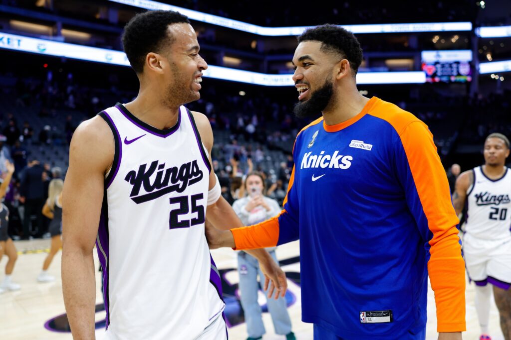 Mar 10, 2025; Sacramento, California, USA; New York Knicks center Karl-Anthony Towns (32) talks with Sacramento Kings center Skal Labissiere (25) after the game at Golden 1 Center. Mandatory Credit: Sergio Estrada-Imagn Images