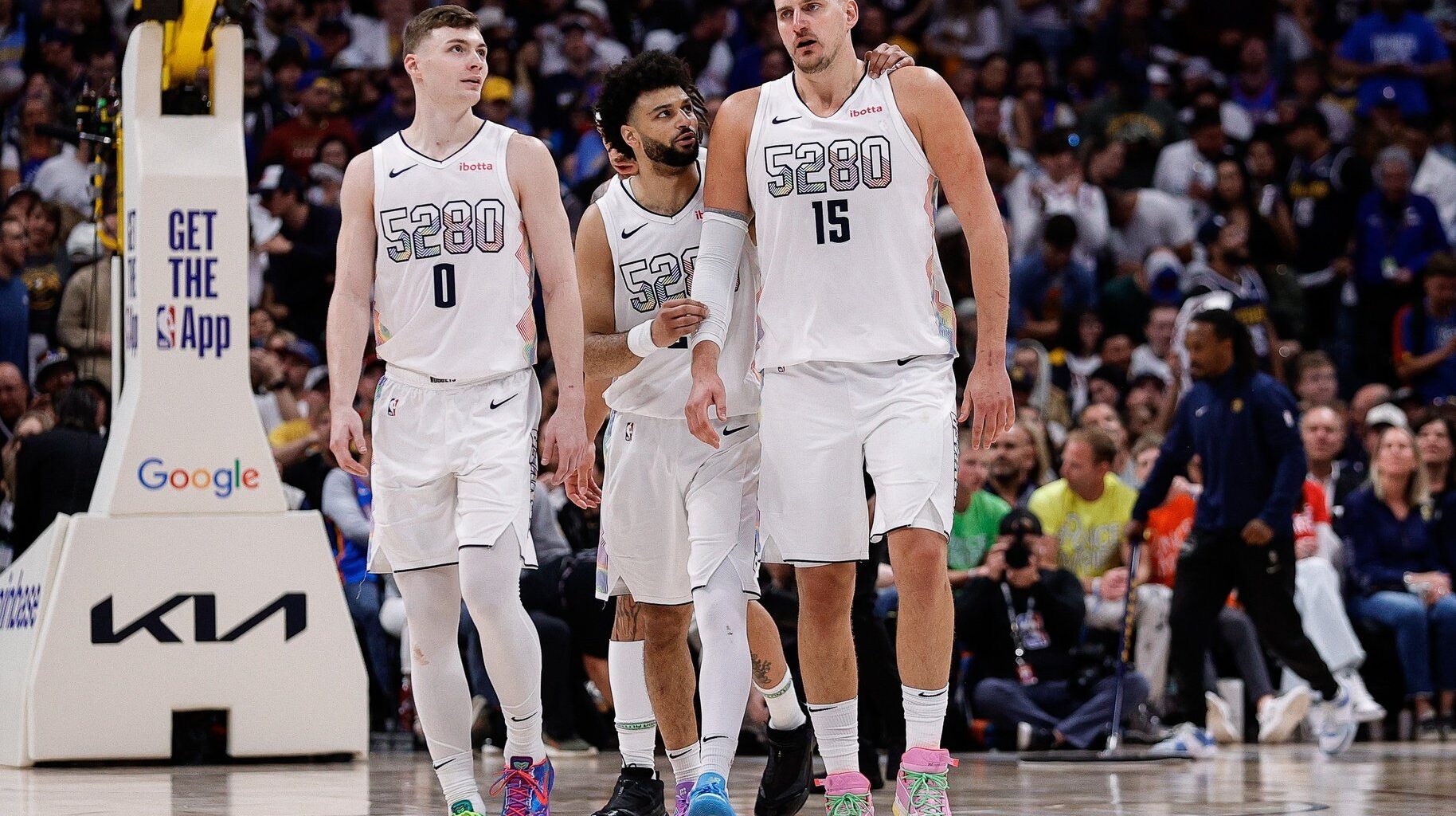 Denver Nuggets guard Jamal Murray (27) and center Nikola Jokic (15) and guard Christian Braun