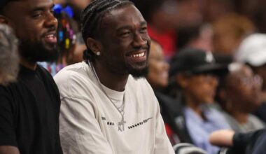 Mark Williams smiles at WNBA game