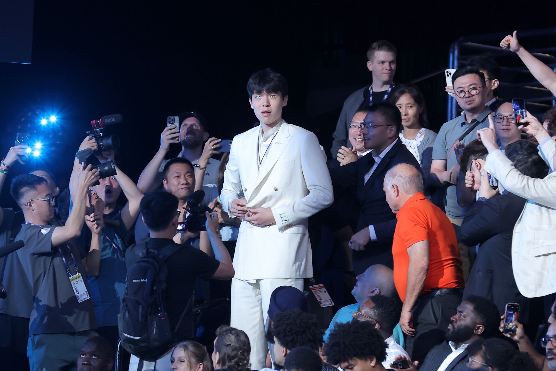 Jun 25, 2025; Brooklyn, NY, USA; Yang Hansen walks to the stage after being selected as the 16th pick by the Memphis Grizzlies in the first round of the 2025 NBA Draft at Barclays Center. Mandatory Credit: Brad Penner-Imagn Images