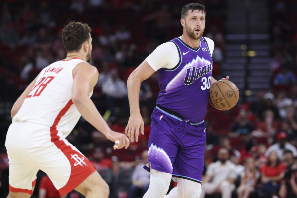 Oct 8, 2025; Houston, Texas, USA; Utah Jazz center Jusuf Nurkic (30) controls the ball as Houston Rockets center Alperen Sengun (28) defends during the first quarter at Toyota Center. Mandatory Credit: Troy Taormina-Imagn Images