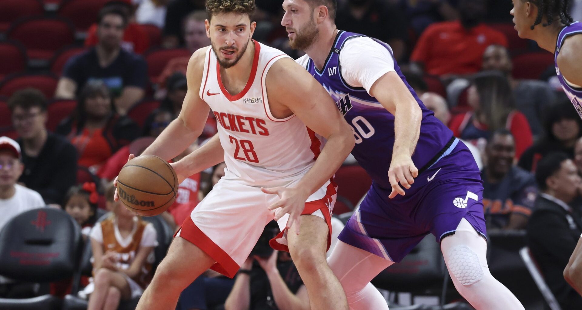 Oct 8, 2025; Houston, Texas, USA; Houston Rockets center Alperen Sengun (28) controls the ball as Utah Jazz center Jusuf Nurkic (30) defends during the second quarter at Toyota Center. Mandatory Credit: Troy Taormina-Imagn Images