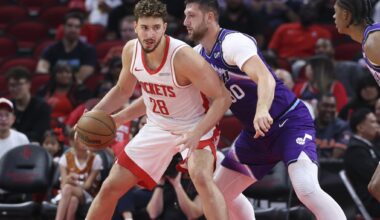 Oct 8, 2025; Houston, Texas, USA; Houston Rockets center Alperen Sengun (28) controls the ball as Utah Jazz center Jusuf Nurkic (30) defends during the second quarter at Toyota Center. Mandatory Credit: Troy Taormina-Imagn Images