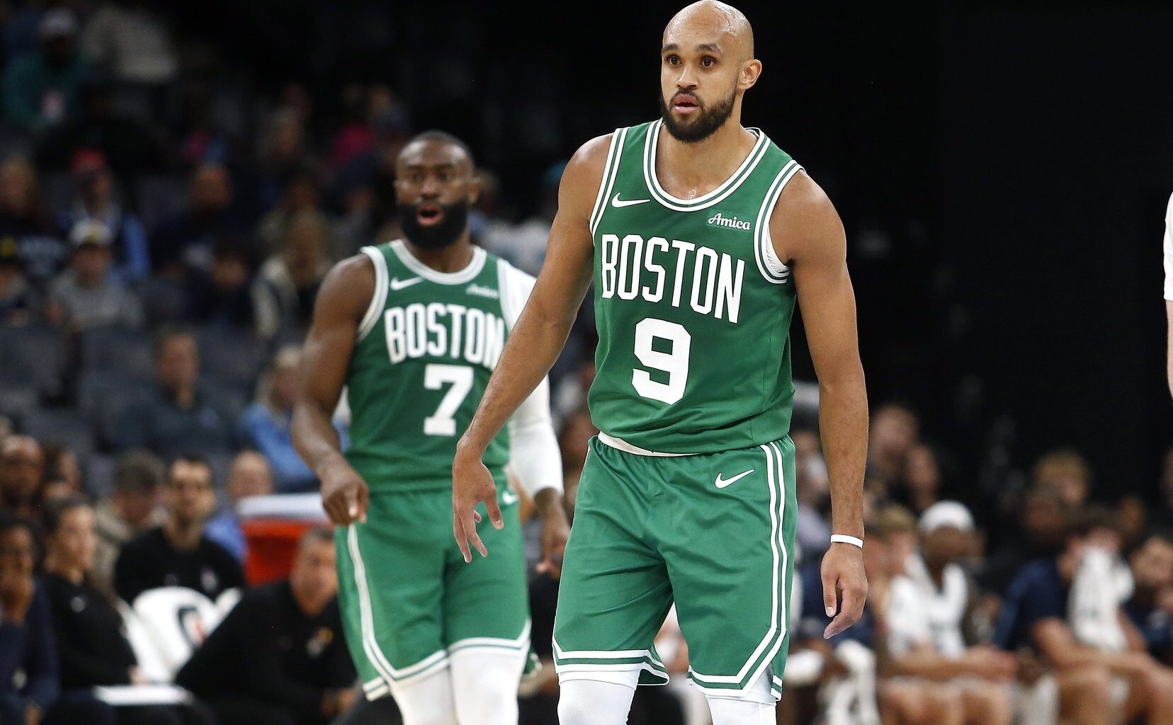 Boston Celtics guard Derrick White in front of teammate Jaylen Brown