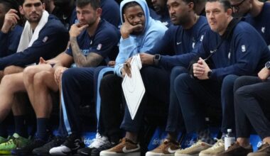 Oct 17, 2025; Miami, Florida, USA; Memphis Grizzlies guard Ja Morant, center, sits on the bench with an injury during the game against the Miami Heat at Kaseya Center. Mandatory Credit: Jim Rassol-Imagn Images