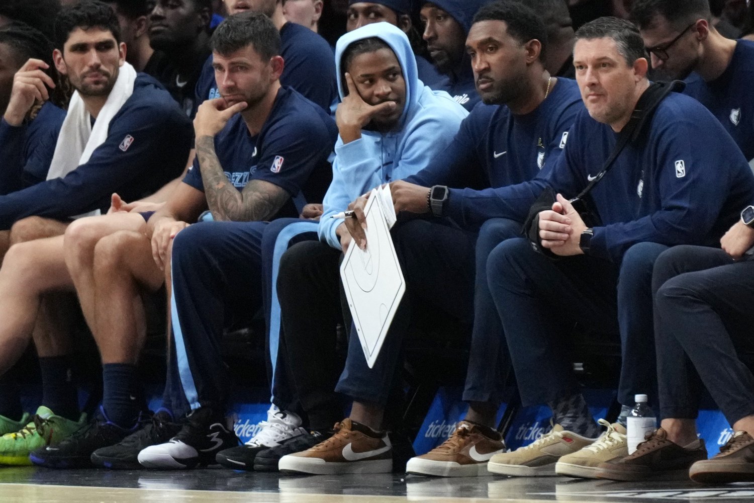 Oct 17, 2025; Miami, Florida, USA; Memphis Grizzlies guard Ja Morant, center, sits on the bench with an injury during the game against the Miami Heat at Kaseya Center. Mandatory Credit: Jim Rassol-Imagn Images