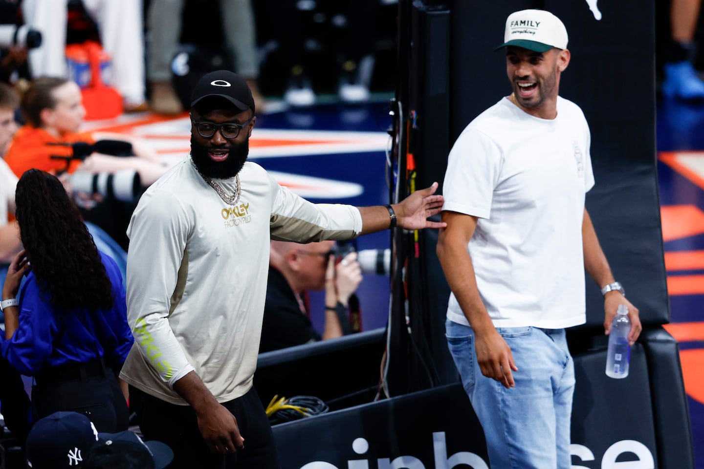 In a change from previous years, Celtics star Jaylen Brown (left) stuck around Massachusetts this offseason, even joining Georges Niang (right) for the Connecticut Sun-Indiana Fever WNBA matchup at TD Garden. 