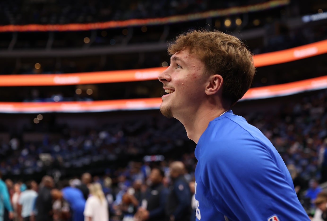 Dallas Mavericks forward Cooper Flagg (32) beams with enthusiasm during team warm-up drills...
