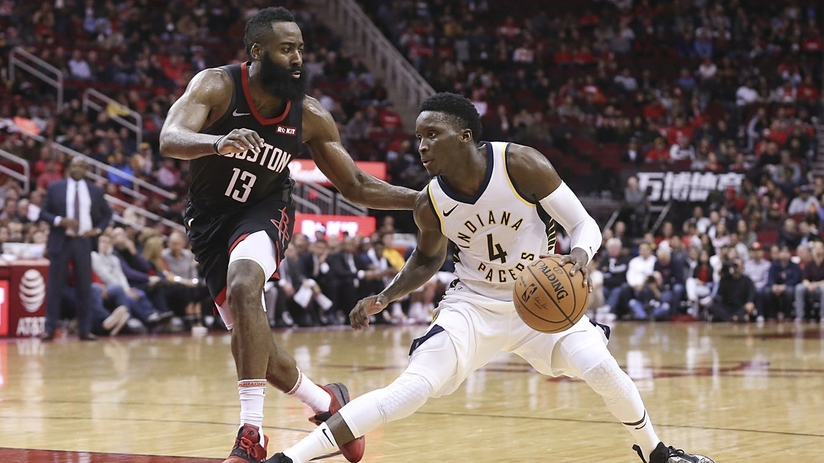 Indiana Pacers guard Victor Oladipo (4) dribbles against Houston Rockets guard James Harden (13) in the second half at Toyota Center.