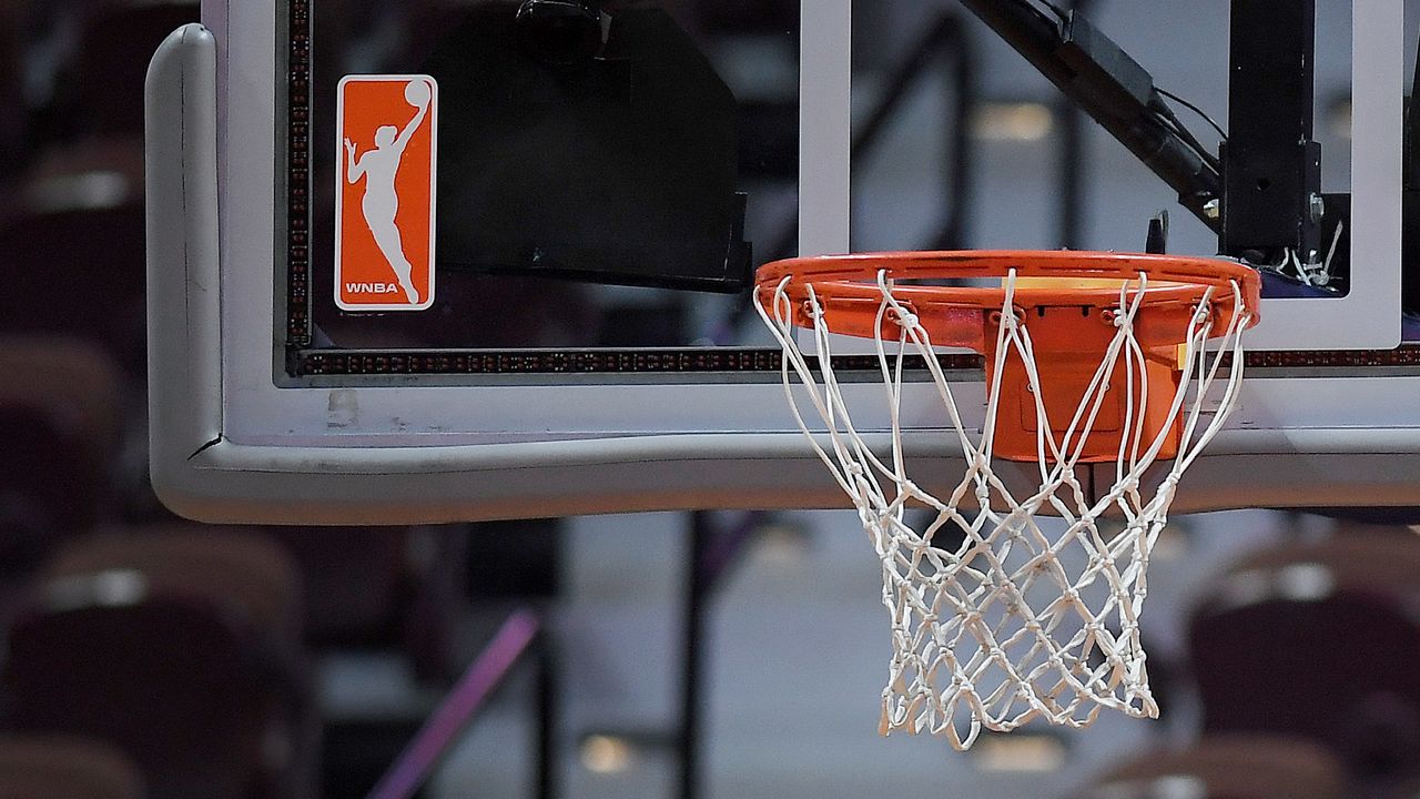 The WNBA logo and hoop are seen at a WNBA basketball game at Mohegan Sun Arena, Tuesday, May 14, 2019, in Uncasville, Conn.