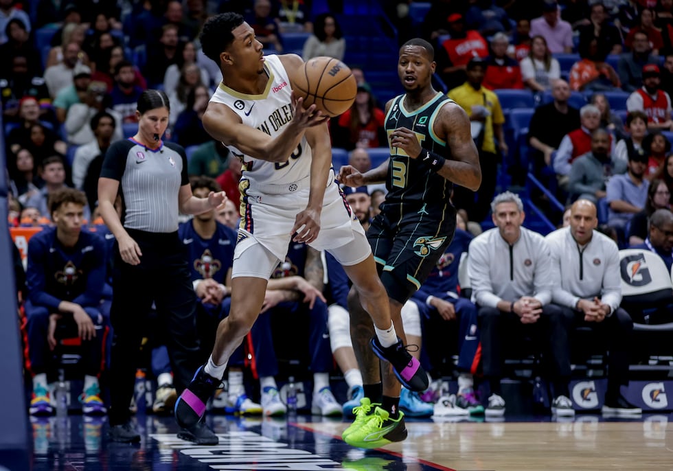 New Orleans Pelicans guard Trey Murphy III (25) saves the ball as Charlotte Hornets guard...