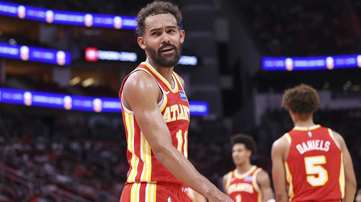Atlanta Hawks guard Trae Young (11) reacts towards a fan during the second quarter against the Houston Rockets at Toyota Center