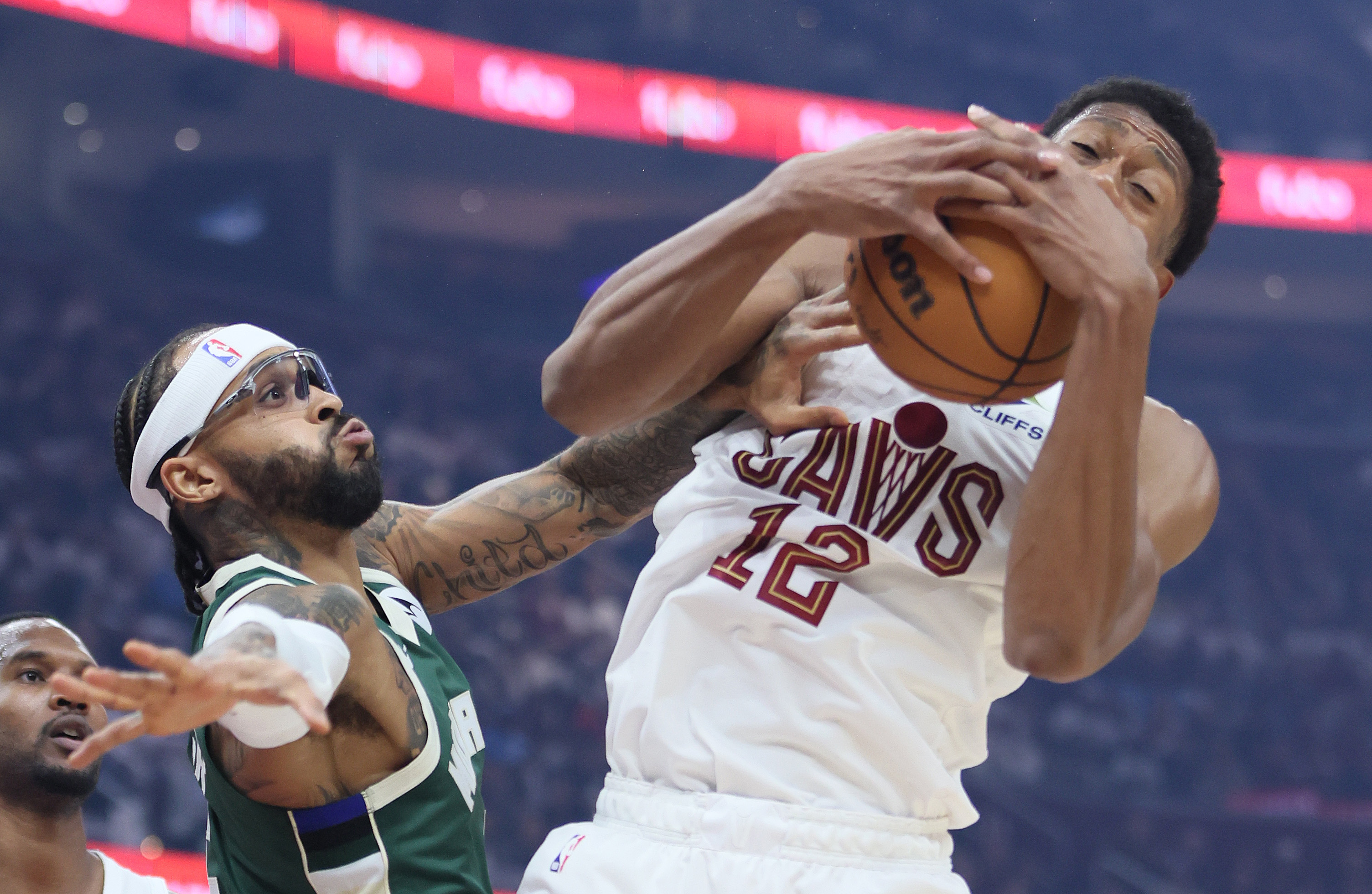 Cleveland Cavaliers forward De'Andre Hunter secures a rebound from Milwaukee Bucks guard Gary Trent Jr. in the first half at Rocket Arena. 