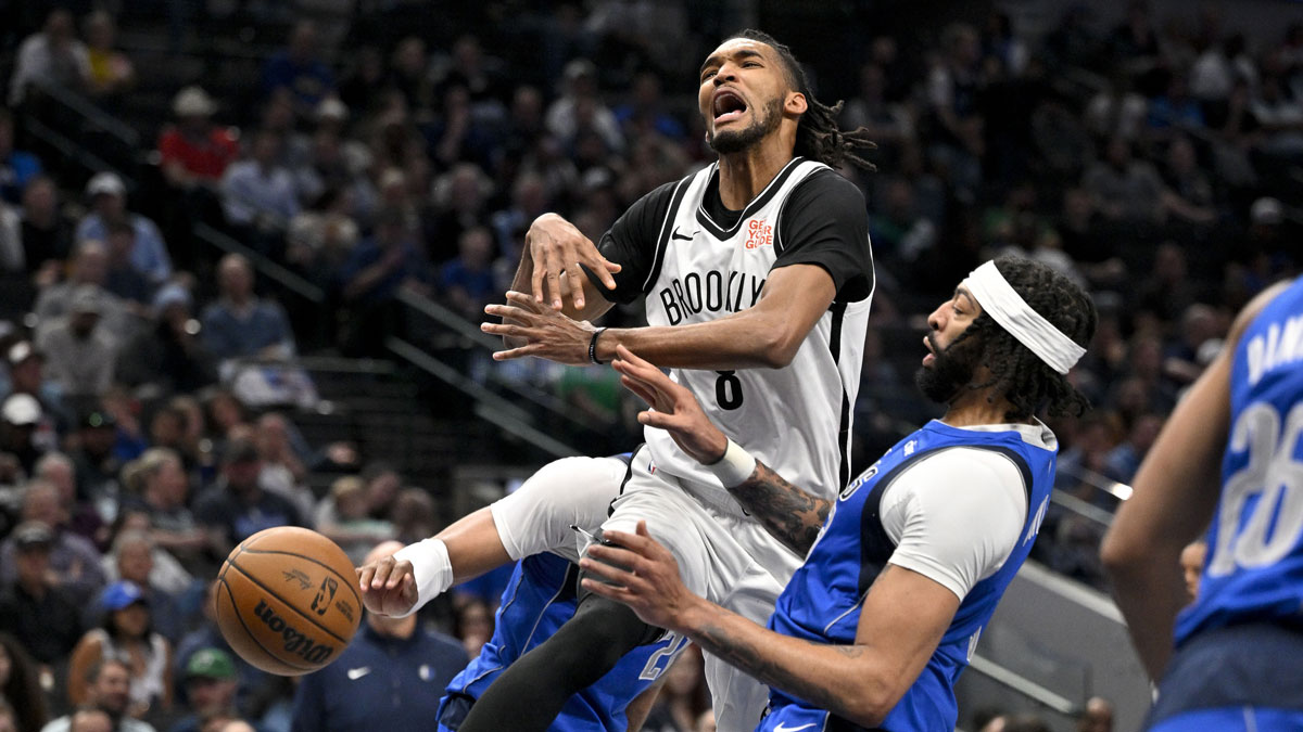 Brooklyn Nets forward Ziaire Williams (8) reacts to losing the ball in front of Dallas Mavericks forward Anthony Davis (3) during the second half at the American Airlines Center.