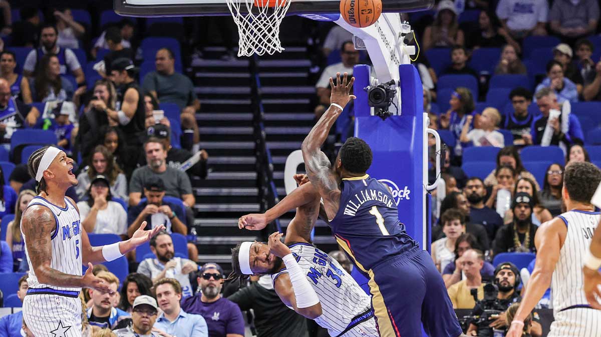 Orlando Magic center/forward Wendell Carter Jr. (34) is fouled by New Orleans Pelicans forward Zion Williamson (1) during the first quarter at Kia Center.
