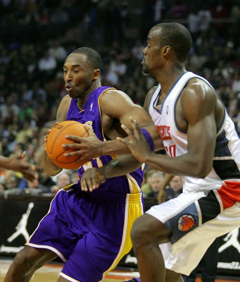 Dec. 29, 2006: Kobe Bryant (left) drives to the basket while being covered by the Charlotte Bobcats' Emeka Okafor at Charlotte Bobcats Arena. Bryant would score 58 points in the game, but Charlotte won, 133-124, in triple overtime.