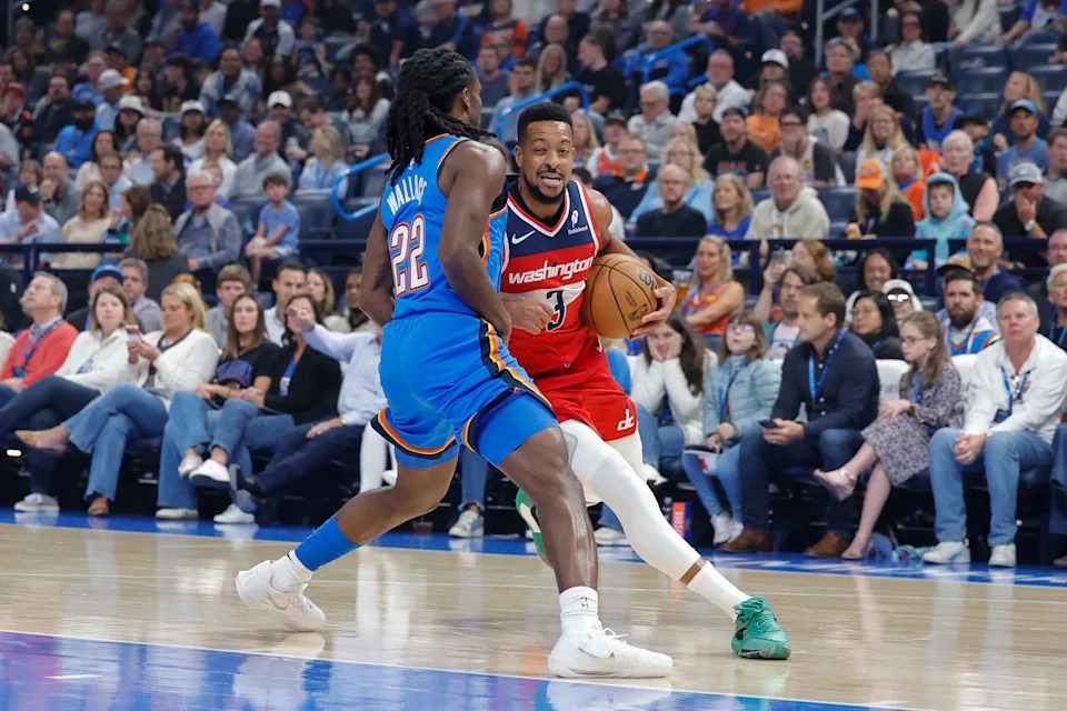 Oct 30, 2025; Oklahoma City, Oklahoma, USA; Washington Wizards guard CJ McCollum (3) drives against Oklahoma City Thunder guard Cason Wallace (22) during the first quarter at Paycom Center. Mandatory Credit: Alonzo Adams-Imagn Images