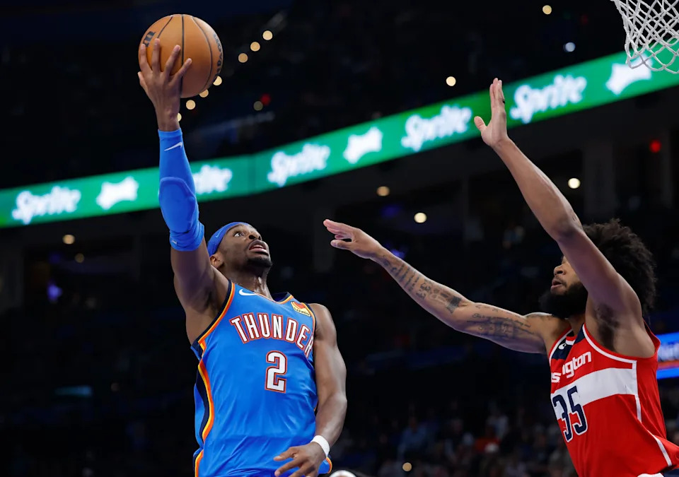 Oct 30, 2025; Oklahoma City, Oklahoma, USA; Oklahoma City Thunder guard Shai Gilgeous-Alexander (2) shoots as Washington Wizards forward Marvin Bagley III (35) defends during the second half at Paycom Center. Mandatory Credit: Alonzo Adams-Imagn Images