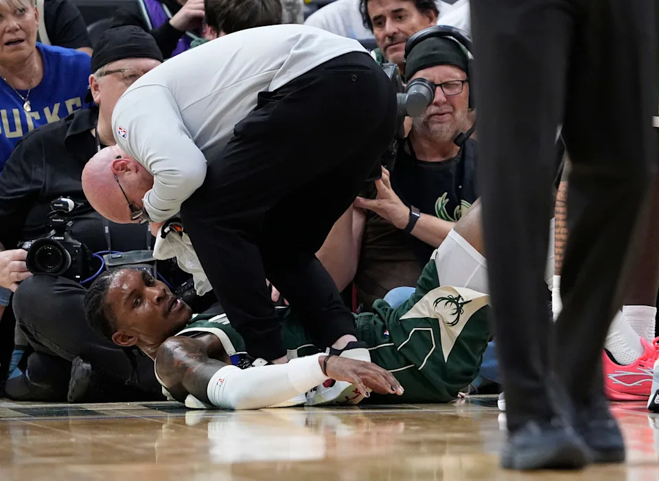 Bucks guard Kevin Porter Jr. goes down with an ankle injury Oct. 22 in a game against the Wizards at Fiserv Forum