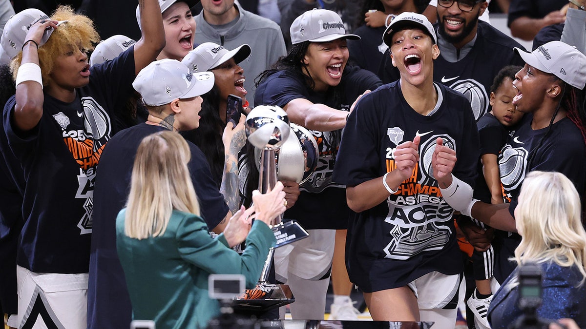 Cathy Engelbert giving trophy