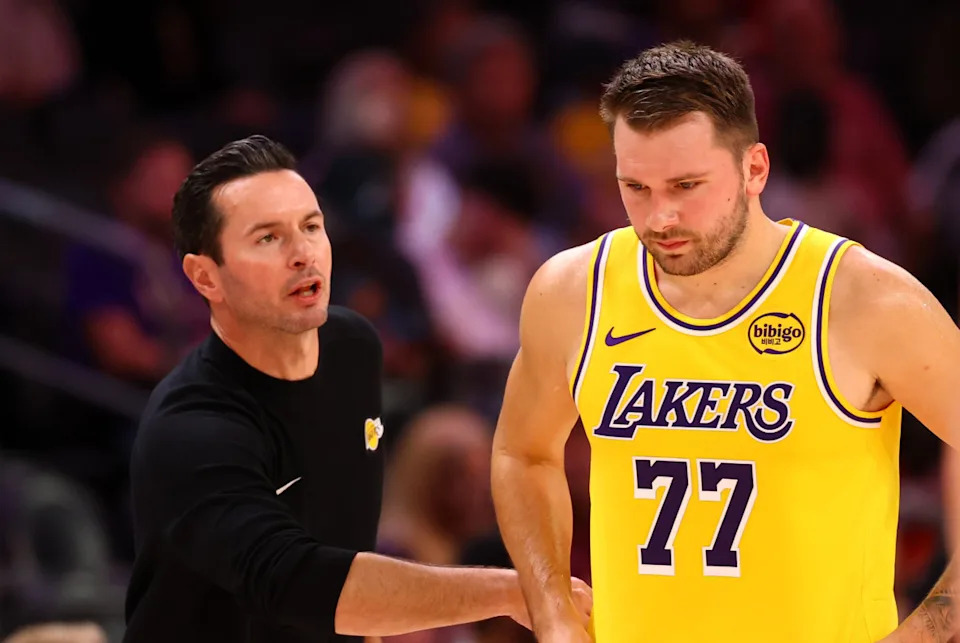 Los Angeles Lakers guard Luka Doncic (77) with head coach JJ Redick during an NBA preseason game.Mark J&period; Rebilas-Imagn Images