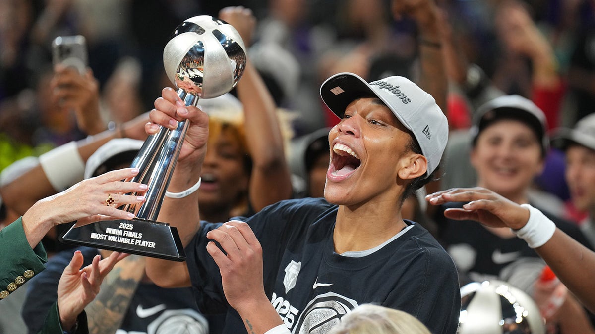 A'ja Wilson holds the WNBA Finals MVP trophy