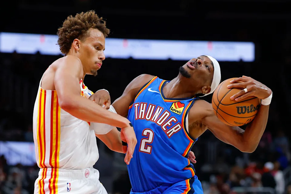 ATLANTA, GEORGIA - OCTOBER 25: Shai Gilgeous-Alexander #2 of the Oklahoma City Thunder is fouled by Dyson Daniels #5 of the Atlanta Hawks during the third quarter at State Farm Arena on October 25, 2025 in Atlanta, Georgia. NOTE TO USER: User expressly acknowledges and agrees that, by downloading and or using this photograph, User is consenting to the terms and conditions of the Getty Images License Agreement. (Photo by Todd Kirkland/Getty Images)