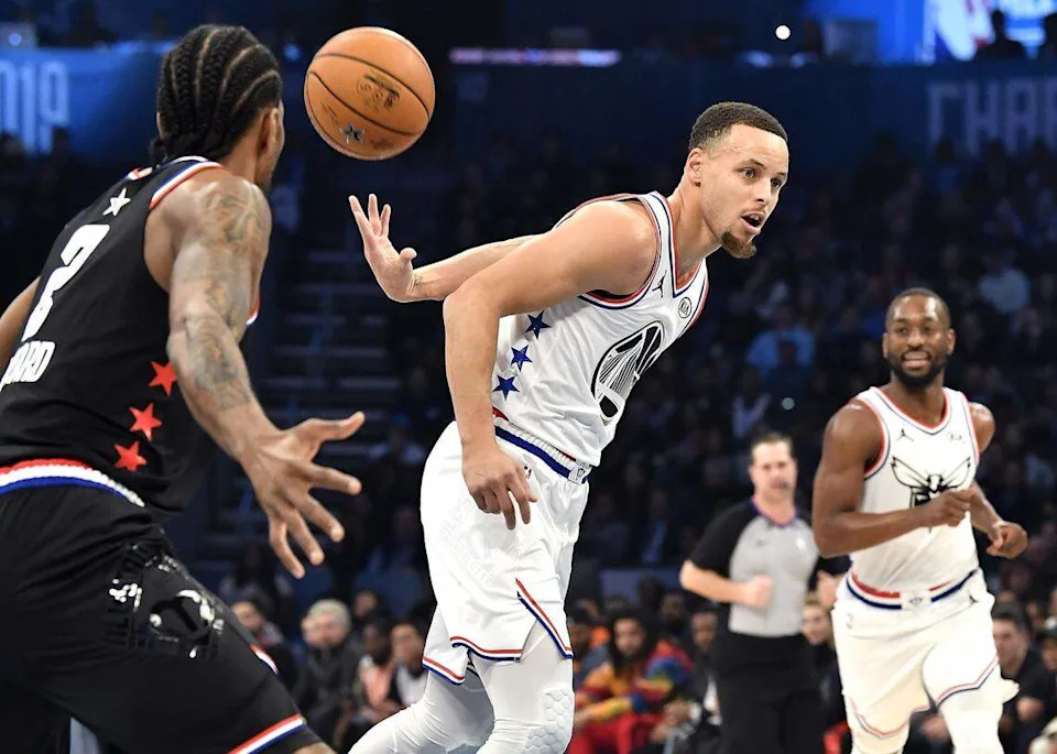 Feb. 17, 2019: Golden State Warriors guard Stephen Curry throws a behind-the-back pass to a teammate on a fast break during the NBA All-Star Game at Spectrum Center in Charlotte.
