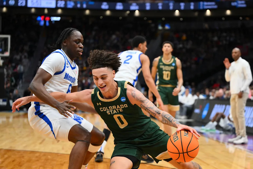 Mar 21, 2025; Seattle, WA, USA; Colorado State Rams guard Kyan Evans (0) attempts to drive the ball past Memphis Tigers guard Baraka Okojie (6) at Climate Pledge Arena. Mandatory Credit: Steven Bisig-Imagn Images