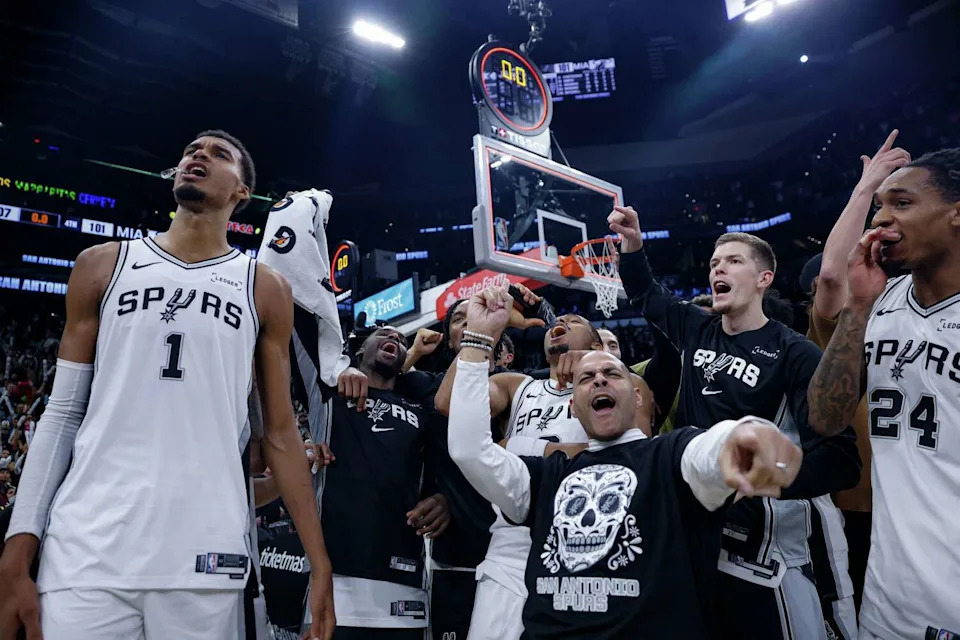 The San Antonio Spurs chant "Go Spurs Go" in unison with the fans as they celebrate their victory over the Miami Heat at Frost Bank Center in San Antonio, Thursday, Oct. 30, 2025. The Spurs defeated the Heat, 107-101, to secure their first 5-0 start in franchise history. (Sam Owens/San Antonio Express-News)