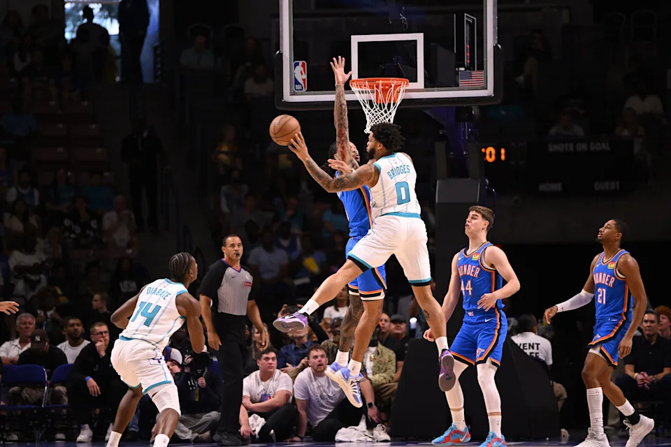 Oct 5, 2025; North Charleston, South Carolina, USA; Charlotte Hornets forward Miles Bridges (0) passes off from the key in the first quarter against the Oklahoma City Thunder at North Charleston Coliseum. Mandatory Credit: Arthur Ellis-Imagn Images