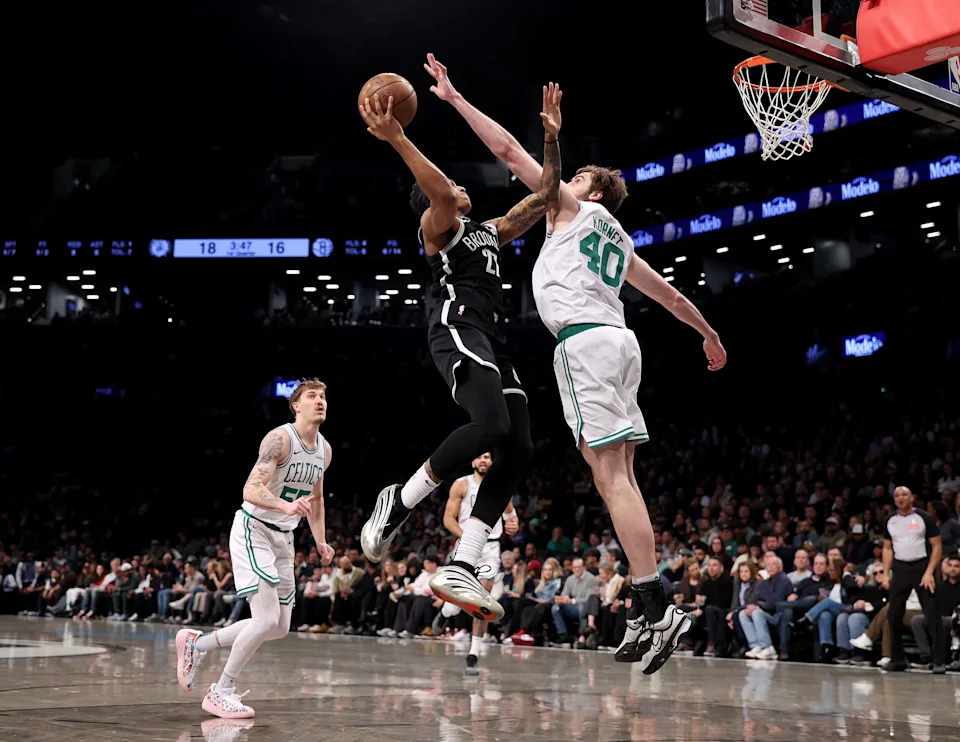 NEW YORK, NEW YORK - MARCH 15: Maxwell Lewis #27 of the Brooklyn Nets heads for the net as Luke Kornet #40 of the Boston Celtics defends during the first half at Barclays Center on March 15, 2025 in the Brooklyn borough of New York City. NOTE TO USER: User expressly acknowledges and agrees that, by downloading and or using this photograph, User is consenting to the terms and conditions of the Getty Images License Agreement. (Photo by Elsa/Getty Images)