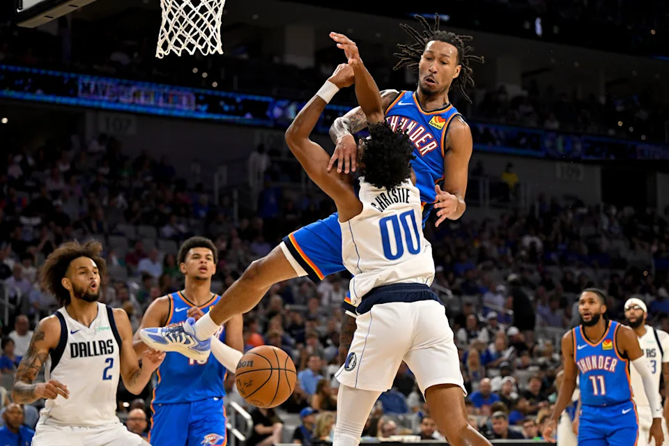 Oct 6, 2025; Fort Worth, Texas, USA; Dallas Mavericks guard Max Christie (00) is fouled by Oklahoma City Thunder forward Jaylin Williams (6) during the second quarter at Dickie's Arena. Mandatory Credit: Jerome Miron-Imagn Images
