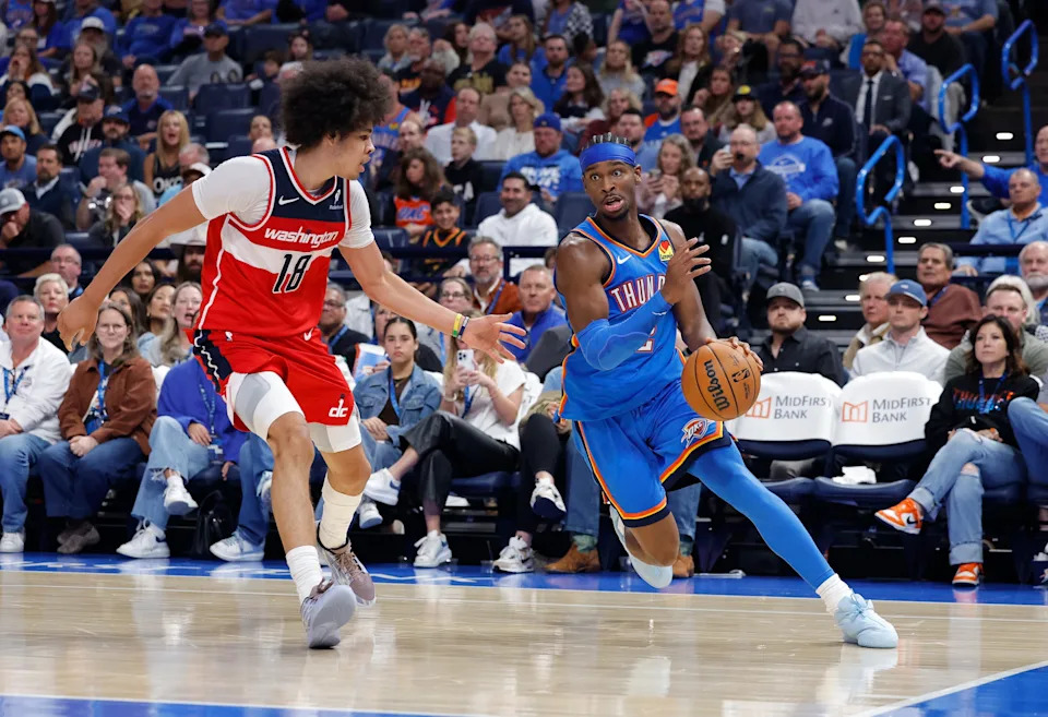Oct 30, 2025; Oklahoma City, Oklahoma, USA; Oklahoma City Thunder guard Shai Gilgeous-Alexander (2) drives around Washington Wizards forward Kyshawn George (18) during the second half at Paycom Center. Mandatory Credit: Alonzo Adams-Imagn Images