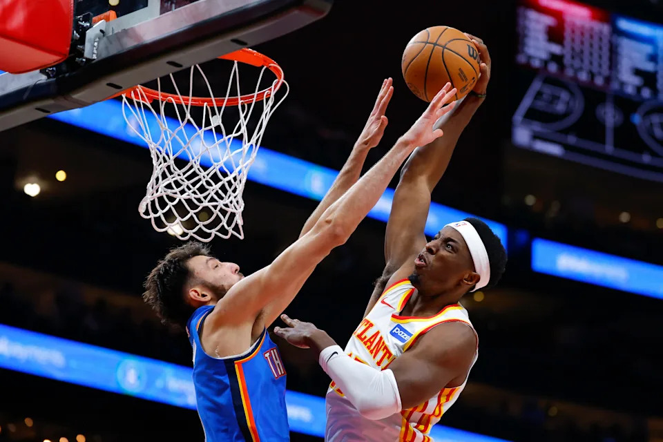 ATLANTA, GEORGIA - OCTOBER 25: Onyeka Okongwu #17 of the Atlanta Hawks dunks against Chet Holmgren #7 of the Oklahoma City Thunder during the first quarter at State Farm Arena on October 25, 2025 in Atlanta, Georgia. NOTE TO USER: User expressly acknowledges and agrees that, by downloading and or using this photograph, User is consenting to the terms and conditions of the Getty Images License Agreement. (Photo by Todd Kirkland/Getty Images)